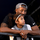 Kobe Bryant and daughter Gianna Bryant watch during day 2 of the Phillips 66 National Swimming Championships at the Woollett Aquatics Center on July 26, 2018 in Irvine, California.